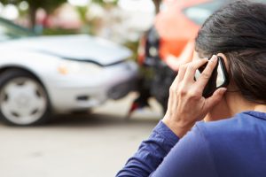 woman calling insurance after accident