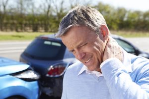 Man with sore neck and whiplash