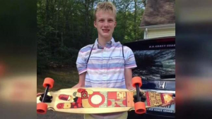 Conor Irwin smiling with skateboard