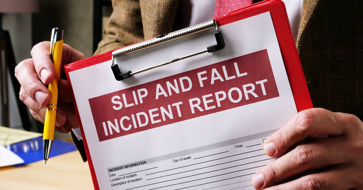lawyer holding Slip and Fall Incident Report form
