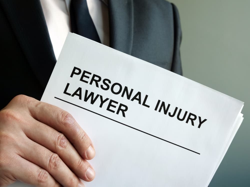 A personal injury attorney stands with a clipboard, ready to advocate with expertise in the field of law.