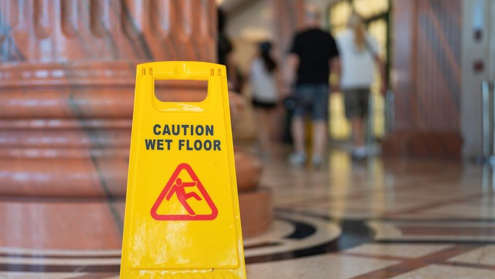 wet floor sign in the atrium of a public building
