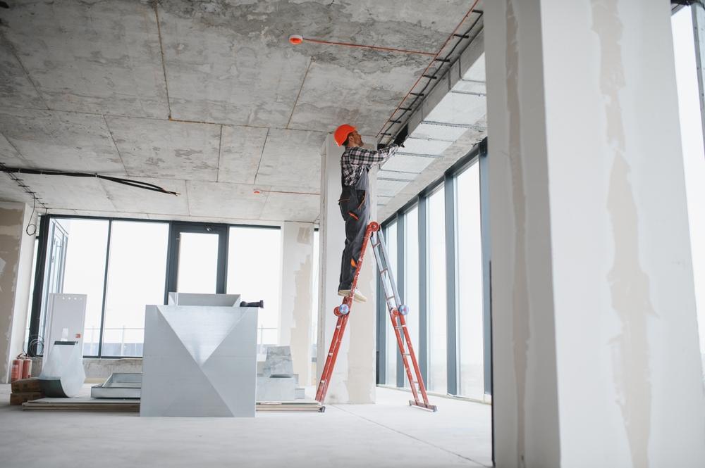 Construction worker inside framed-out high-rise
