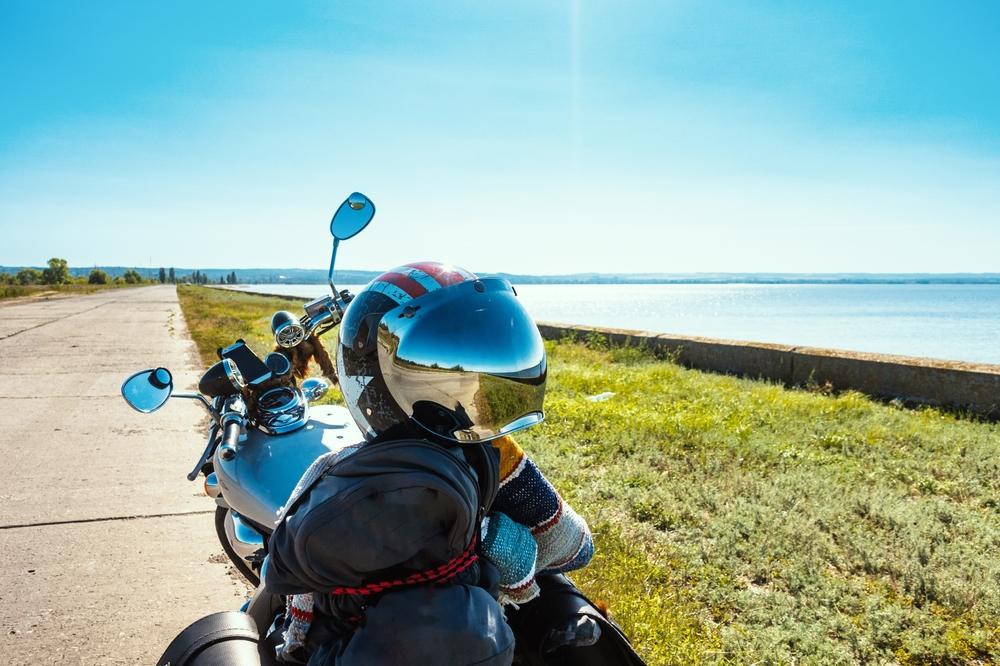Parked motorcycle with helmet on the seat